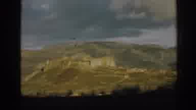 Ephesus Turkey (1962): Mountains With Clouds And People Walking Down Street