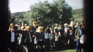 Izmir Turkey (1962): White Men Dancing Linked Arm And Arm In-front Of Crowd