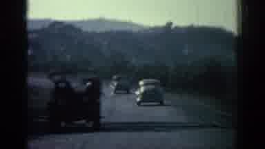 Rhodes Greece (1962): Lots Of Cars Crossing A Road Surrounded By Vegetation