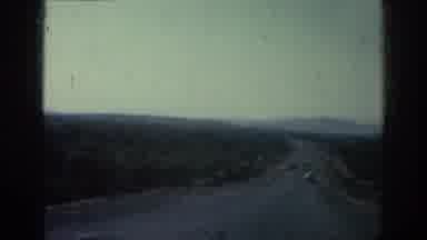 Rhodes Greece (1962): Man Car Driving Countryside Road Camera Pan Pulling In
