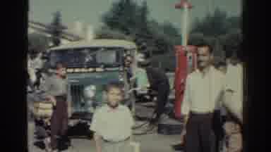 Rhodes Greece (1962): People At Gas Station Looking At Car Under The Hood On Sunny