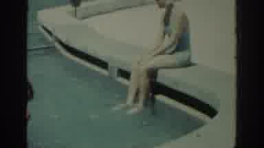 Rhodes Greece (1962): Woman Wearing White Swimwear Splashes Kids In Pool On A