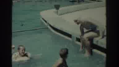 Rhodes Greece (1962): Woman Wearing Blue Swimwear Splashes Kids In Swimming Pool