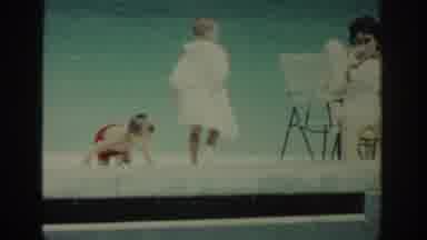 Rhodes Greece (1962): Woman Wearing Blue Swimwear Sits On Metal Bar Above Pool On