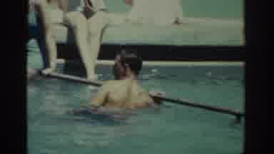 Rhodes Greece (1962): Man Swims In Pool And Sits In Chair Along With Friends And
