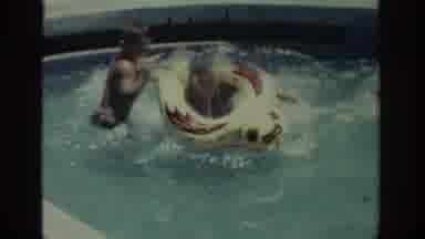 Rhodes Greece (1962): Woman Wearing Blue Swimwear Watches Two Boys Play With Red