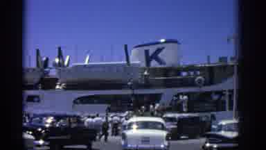 RHODES GREECE-1962: People Boarding A Ferry At A Bustling Port