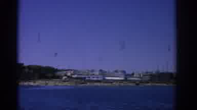 RHODES GREECE-1962: A Small Coastal City Seen From A Body Of Water