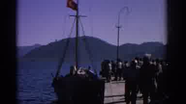 RHODES GREECE-1962: People On Pier With Turkish Flag Boat
