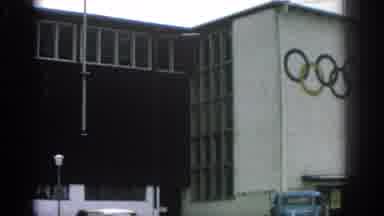 Munich Germany (1963): View Of Olympic Building By Snowy Mountains And Man Walking