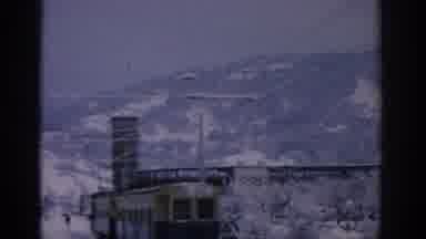 Munich Germany (1963): View Of Snow Covered Mountains And Yellow Train On A Cloudy
