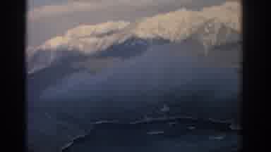 Munich Germany (1963): Aerial Footage Of Snowy Mountain Top Peaks With Trees And