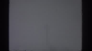 Munich Germany (1963): A Lady Climbs A Ladder Alone Wearing Cold Clothes In A