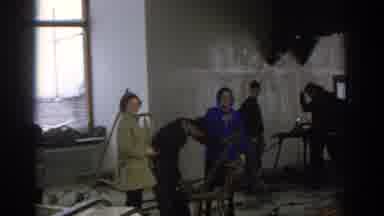 Munich Germany (1963): Man Wearing Black Sweater Hammers Grey Object At Indoor