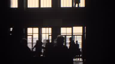 Munich Germany (1963): People Walking Through Turnstile Inside Of A Dimly Lit