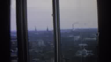 WARSAW POLAND-1963: Panoramic City View Through Window With Church Spires And Factory Chimney