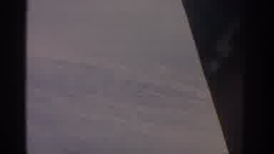 Warsaw Poland (1963): Aerial View Of Plane Flying Over White Clouds On A Sunny Day