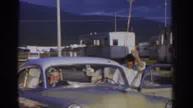 ZURICH SWIZTERLAND-1963: Classic Car And Family At Trailer Park
