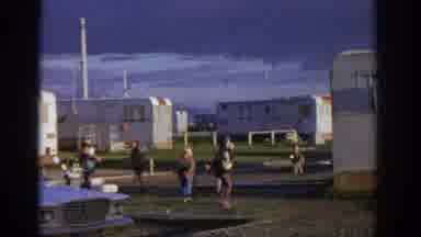 ZURICH SWIZTERLAND-1963: Children Playing Near Caravans On A Cloudy Day