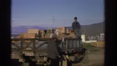 ZURICH SWIZTERLAND-1963: Men Loading A Truck With Boxes In Vintage 8mm Footage