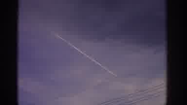 Zurich Swizterland (1963): A Airplane Crossing The Sky And Leaving Behind The Gas