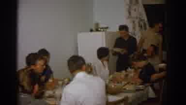 Zurich Swizterland (1963): Family Serving And Enjoying Dinner Together In Kitchen