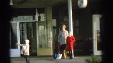 Zurich Swizterland (1963): Buildings Kids Stores Blue Sky Doors Yellow Taxi