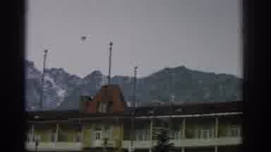 ZURICH SWIZTERLAND-1963: The View Of An Apartment Complex With Hills In The Background