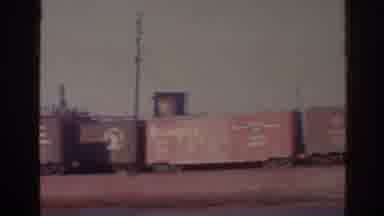 Florida USA (1962): View Of Train Cars On Brown Barge On A Clear Sunny Day