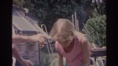 Florida USA (1962): Blonde Girl In Red And White Dress Makes Silly Face Near Trees