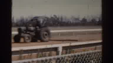 Florida USA (1962): Antique Car Tractor Rolls Down Track With Spectators Watching