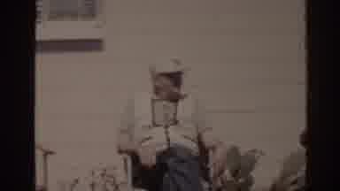 Florida USA (1962): Old Film Showing Two Gentlemen Sitting In A Chair Sunbathing