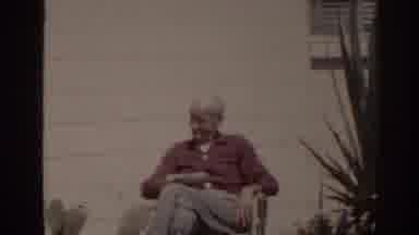 Florida USA (1962): Pensioner Sits In The Garden In A Deck Chair Reading News