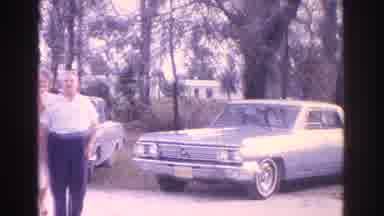 Florida USA (1962): Group Of People Standing In Front Of Car And Outside Of House