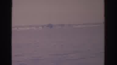 Florida USA (1962): A Large Body Of Water And A Jet Ski Passing By Quickly