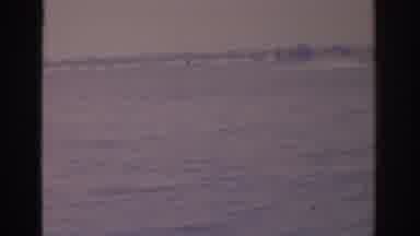 Florida USA (1962): On A Cloudy Day A Speed Boat In The Distance Zooming Past The