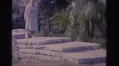 Florida USA (1962): An Elderly Lady Walking Over A Cute Stone Bridge In An