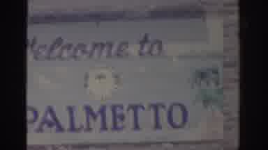 Florida USA (1962): Sign Reads Welcome To Palmetto And View Of A Mounted Tarpon On
