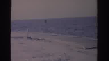 Florida USA (1962): A Person Walks And Then Looks Over At The Coast From The Beach