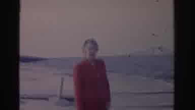 Florida USA (1962): Old Lady On The Beach And In The Back The View Of A Bridge