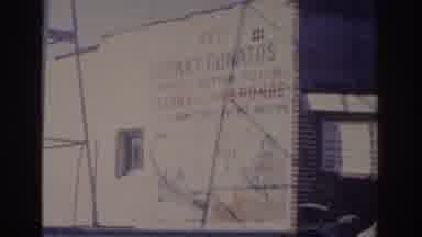 Florida USA (1962): Film Of The Side Of A White Building With An Advertise Printed
