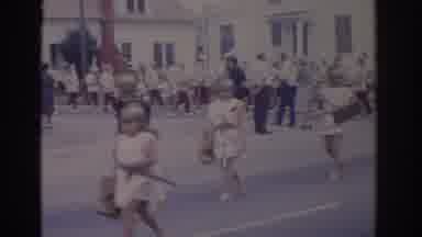 Florida USA (1962): People Dressed In White Costumes Walking In Formation Down