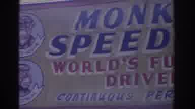 Florida USA (1962): View Of Blue Red And Yellow Monkey Speedway Sign On A Sunny