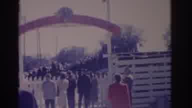 Florida USA-1962: Walking To Fair Entrance With Red Gateway And White Fence Pan
