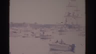 Florida USA (1962): Brown Ship With Red Banners Fires Cannon In Crowded Harbor On