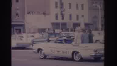 Florida USA (1962): A Parade Of Cars Driving Through A Very Big City