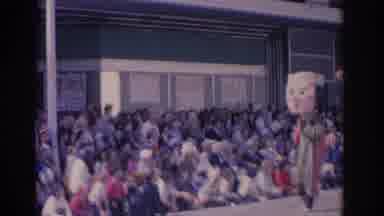 Florida USA (1962): A Parade With Tall Costumes Being Watched By Lots Of People
