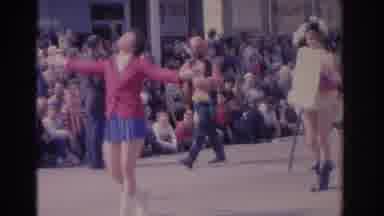 Florida USA (1962): Woman Wearing Red Jacket Twirls Baton In Parade On A Sunny Day