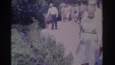 Florida USA (1962): A Group Of People In Suits And Dresses Visit A Sign With