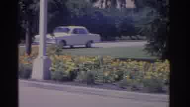 Florida USA (1962): A White Car Close To A Garden In A Daylight